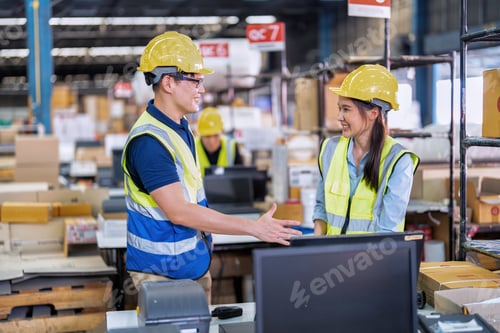 Preview: Staff working in large depot storage warehouse trainee check packing box and scan at cashier counter