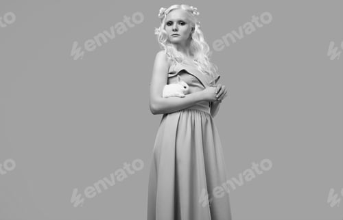 Preview: Fashion Portrait Of Albino Blond Girl With White Skin And Blue Eyes In Elegant Dress Posing With
