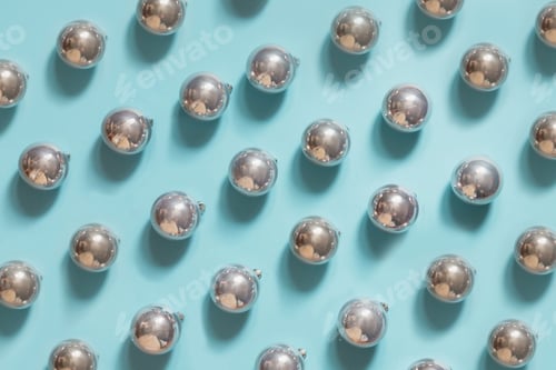 Preview: Christmas silver balls on punchy pastel blue background.