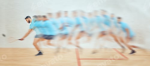Preview: Young athletic squash player running while playing court game with motion blur. Fit active mixed ra