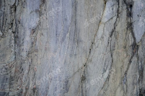 Preview: Close-up texture of a rough stone surface with natural patterns and cracks