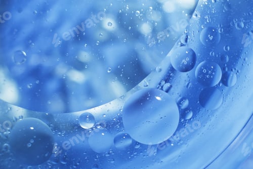 Preview: Oil bubbles close up. circles of water macro. abstract light blue background