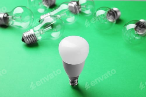 Preview: LED and incandescent lamp bulbs on green background