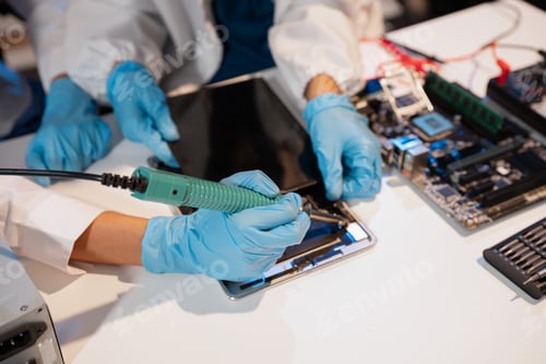 Preview: killed hands repairing electronic devices with precision. technology repair