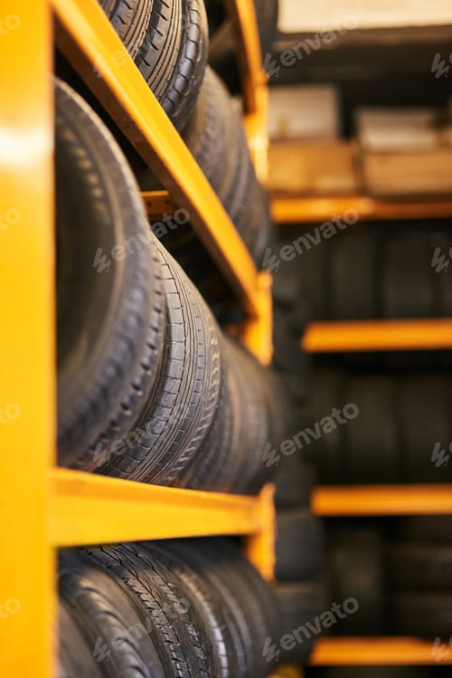 Preview: Workshop full of wheels. Closeup shot of a pile of car tyres.