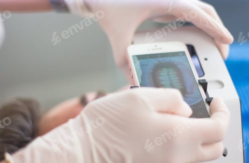 Preview: Conceptual shot of a dentist taking a patient dentures