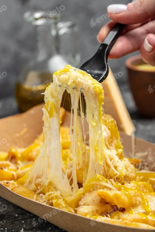 Preview: Cheddar Cheese Poured on top Deep Fried French Fries, Fast food take away. copy space