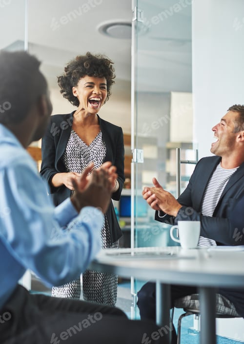 Preview: Shot of colleagues laughing together in an office
