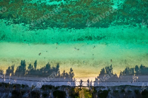 Preview: View from the height of the east coast of the island of Mauritius. Flying over the turquoise lagoon