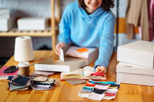 Preview: Close-up of preparing a parcel on the table. Woman online store, small business owner, entrepreneur.
