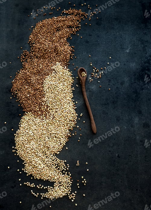 Preview: Green and brown buckwheat groats on dark grunge background