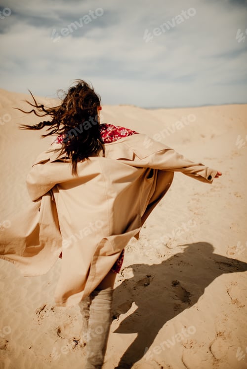 Preview: Woman Runs Freely in a Desert Trench Coat