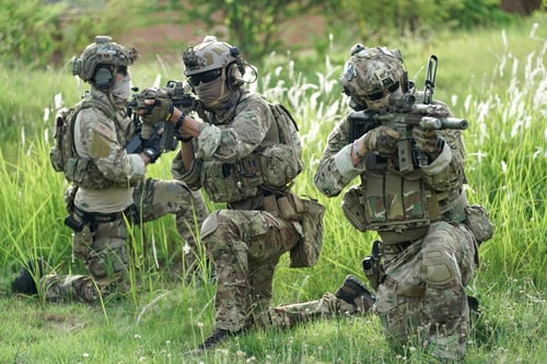 Preview: Soldier in full US MARSOC armed with assault rifle run through the abandoned building. Military