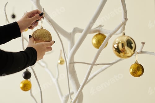 Preview: Woman Decorating Tree with Baubles