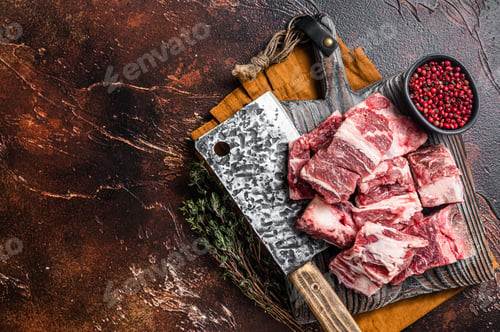 Preview: Butcher board with Raw diced beef and lamb meat ready for cooking. Dark background