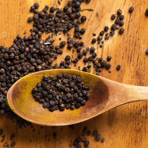 Preview: Spoon and heap of pepper on the table