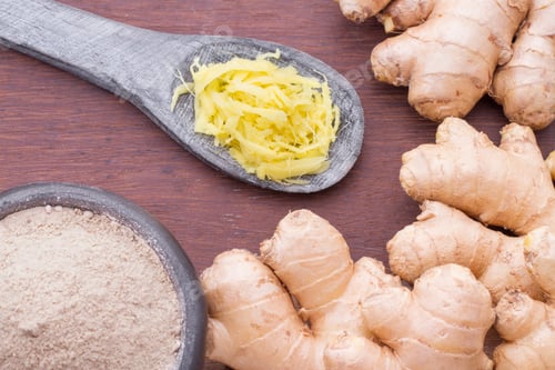 Preview: Roots and ginger powder on the table, top view