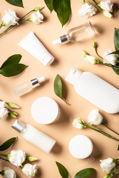 Preview: Natural cosmetic products with green leaves and flowers.
