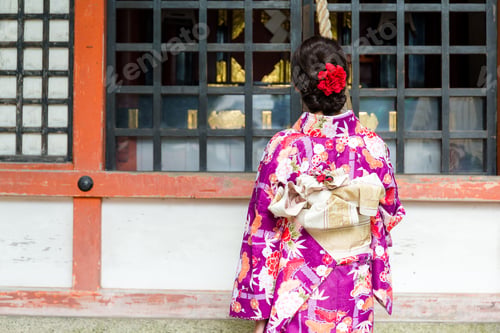 Preview: Back view of woman ring the bell