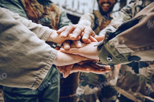 Preview: Soldier, team building or hands in a huddle for a mission, strategy or motivation on a paintball ba