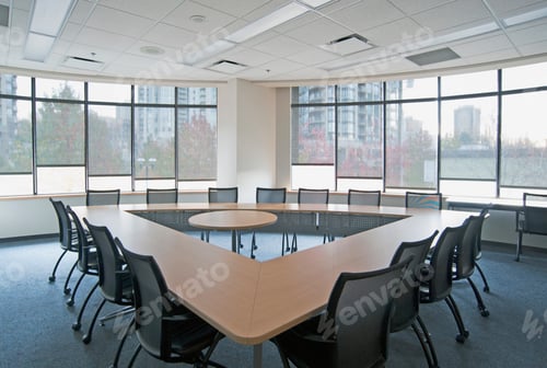 Preview: Large empty boardroom. A long narrow table in a triangle formation with a gap in the centre.