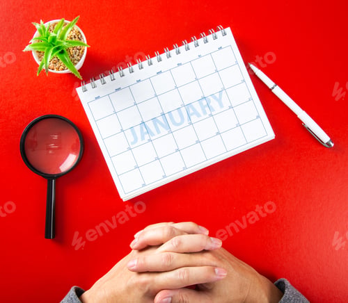 Preview: close up of calendar on red background, planning for business meeting
