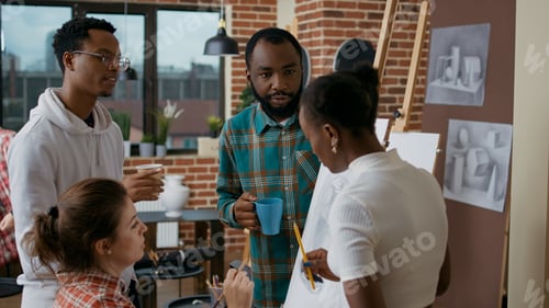 Preview: Group of artistic people brainstorming ideas to create drawing