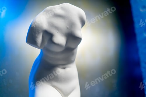 Preview: close-up white sculpture in the form of a body standing on a barrel museum exhibit performance art
