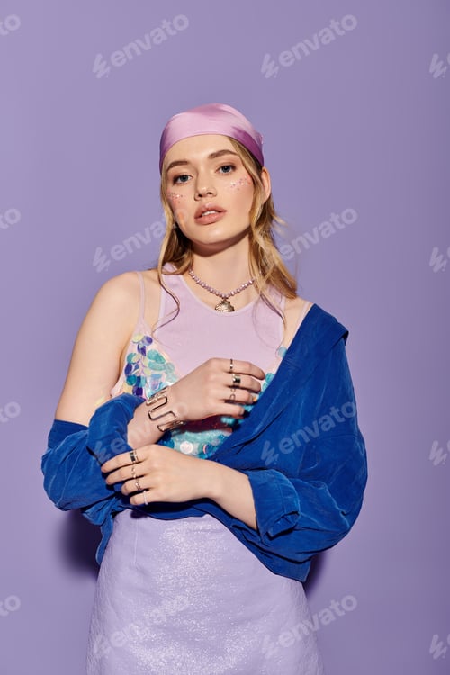 Preview: Stylish young woman in vibrant attire poses against a colorful backdrop during springtime
