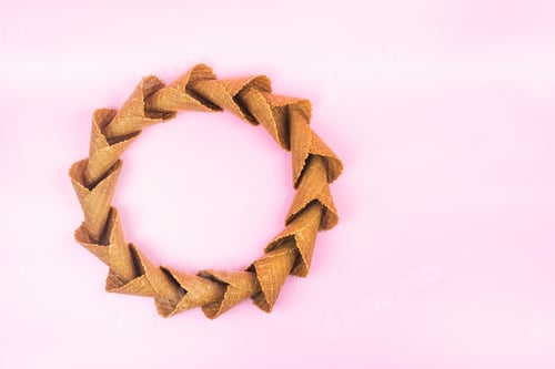 Preview: smooth circle of waffle cones for ice cream on a pink background