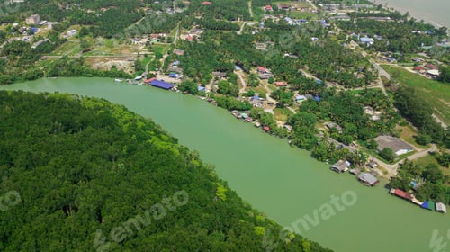 Preview: Aerial drone view of a river with rural settlements in Sedili Kecil, Johor, Malaysia