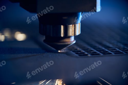 Preview: CNC Laser cutting of metal close up, modern industrial technology. Small depth of field