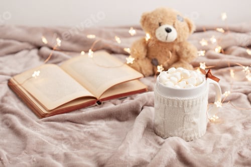Preview: Hot chocolate with marshmallows on soft plaid background with Christmas lights. Perfect winter time