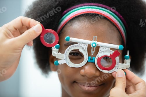Preview: close up opthalmology trial frame with young woman african american eye test ophthalmological in opt