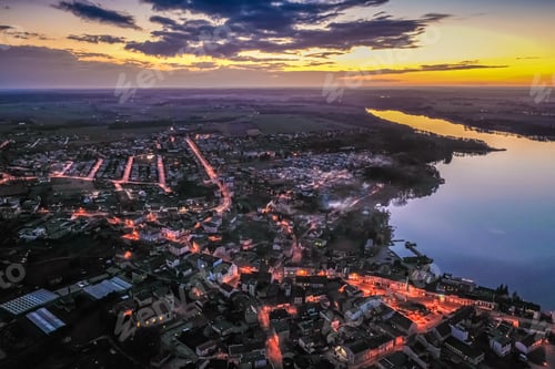 Preview: Downtown by lake with smog at sunset, aerial view
