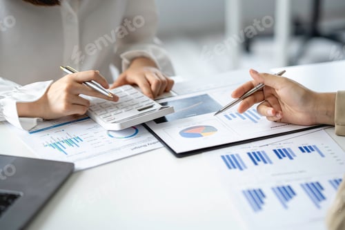 Preview: Close up of female accountant or banker making calculations. Savings, finances, and economy concept.
