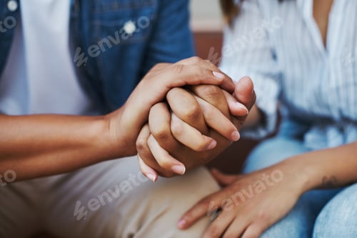 Preview: Cropped shot of an affectionate unrecognizable couple sitting outside on their patio in the yard