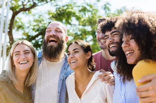 Preview: Young group of diverse friends having fun outdoors in a sunny day