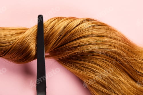 Preview: Top view of clip on twisted brown hair on pink background