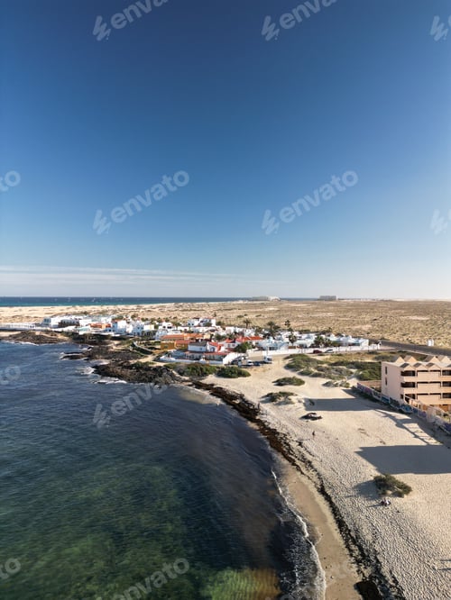 Preview: a large sandy beach next to the water's edge