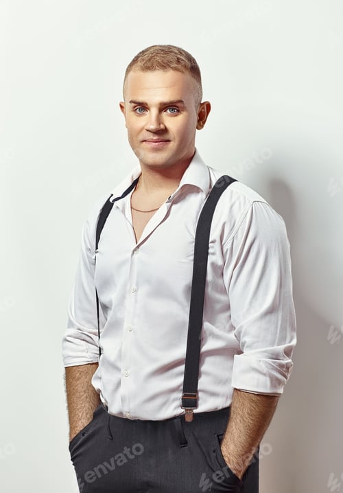 Preview: Portrait of handsome young man in white shirt and suspenders
