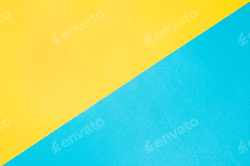 Preview: Textured paper background, top view. Yellow-blue colored backdrop. Two dioganal backgrounds