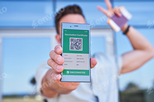 Preview: Hand man holding smartphone displaying on app mobile valid digital green vaccination certificate for