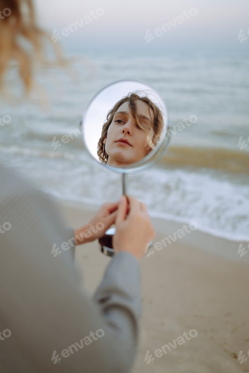 Preview: Fashion Model posing near the sea. Young woman resting in nature. People, lifestyle, relaxation.