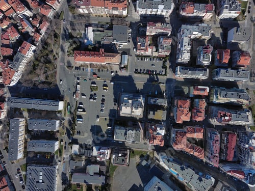 Preview: View from a height of the city of Pomorie with many cars, houses and hotels