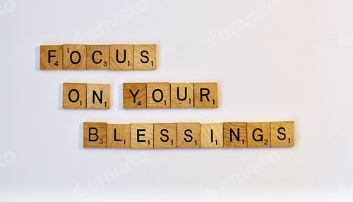Preview: Focus on your blessings in wooden letters on a white background