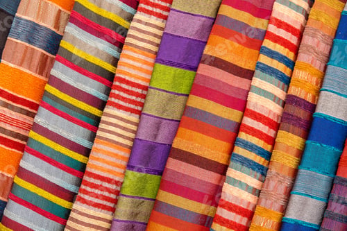 Preview: Closeup shot of different colorful Asian textiles with stripes