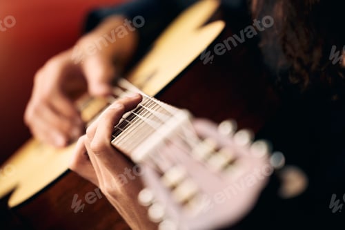 Preview: Strumming away. Cropped shot of an unrecognizable man playing guitar.