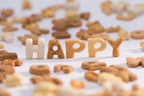Preview: Close-up view of word happy and healthy breakfast cereal alphabet isolated on grey