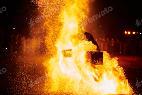 Preview: Silhouette of Two Fire Performers Creating Sparks Against Night field